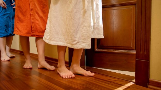 Parents,And,Children,In,Bathrobes,And,Bath,Towels,Waiting,For ensuite bathroom
