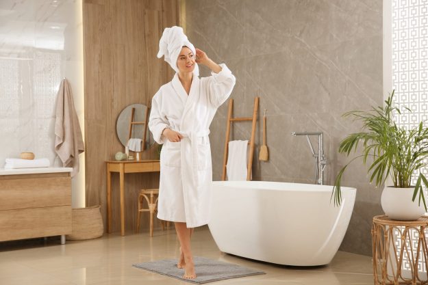 Beautiful,Woman,Wearing,White,Robe,In,Bathroom luxury bathroom